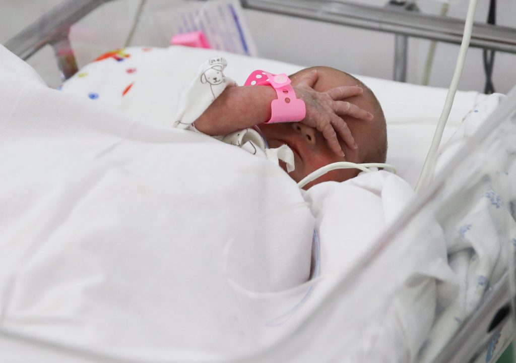 8131445 03.03.2022 A newborn is pictured at an intensive care unit at the perinatal centre, in Krasnodar, Russia. Vitaly Timkiv / Sputnik